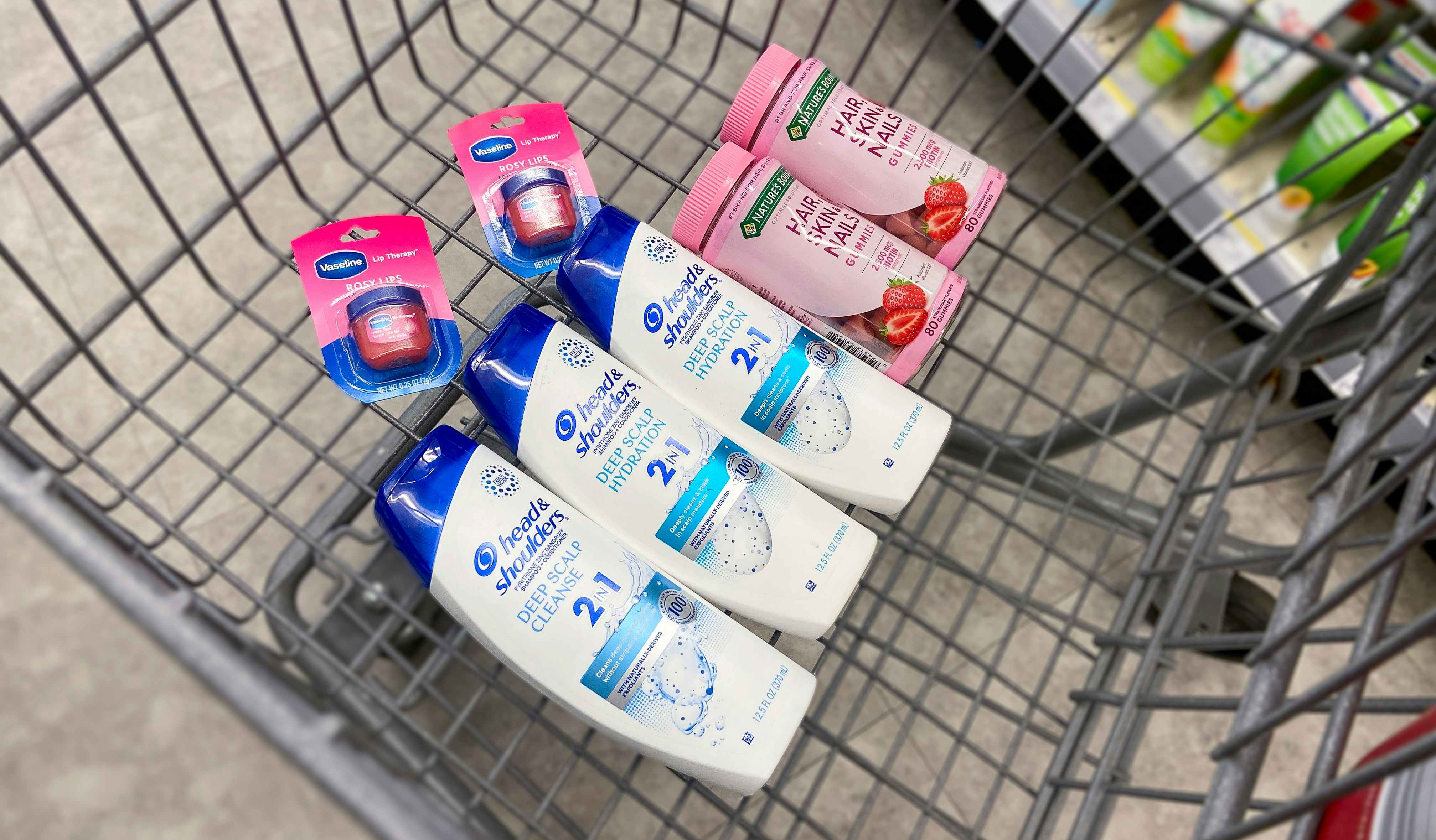 a walgreens cart with head & shoulders, nature's bounty hair skin and nail, vaseline lip therapy