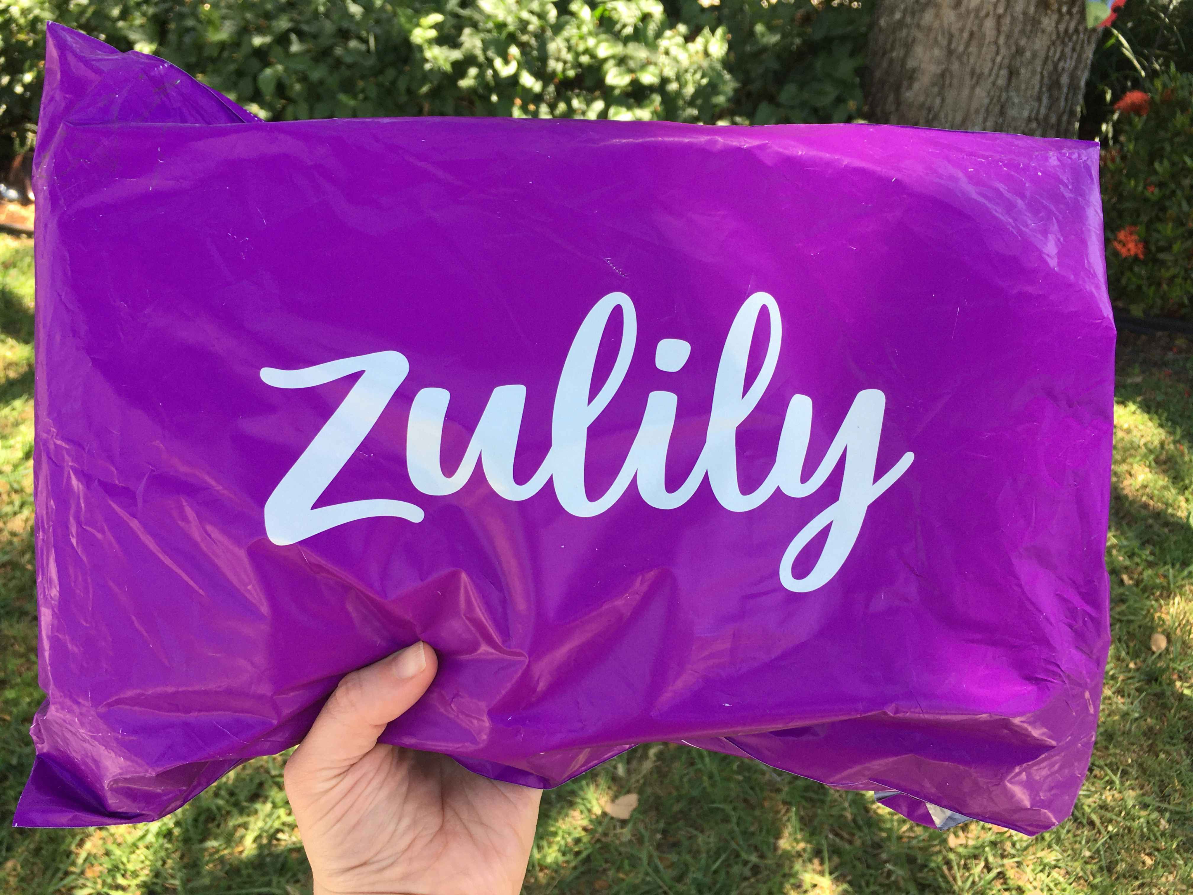 zulily shipping bag being held up