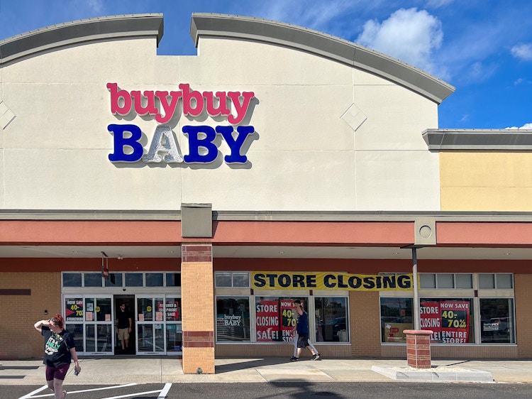 A buybuy Baby store front with people coming in and out
