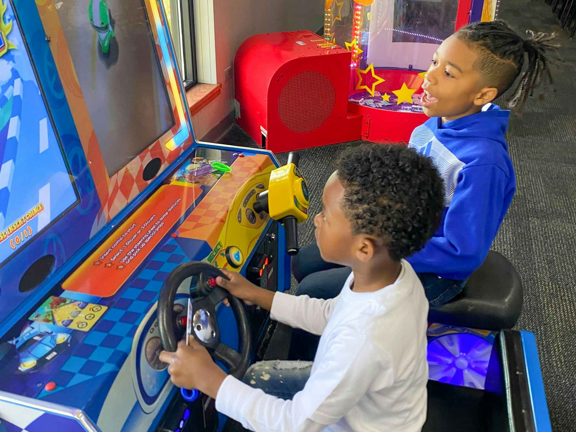 Kids playing games at Chuck E Cheese