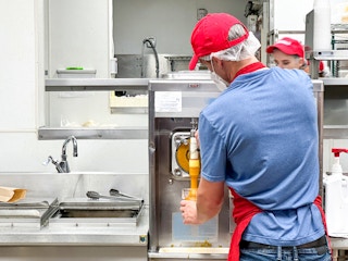 costco employee making a mango smoothie