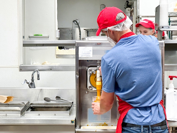 costco employee making a mango smoothie