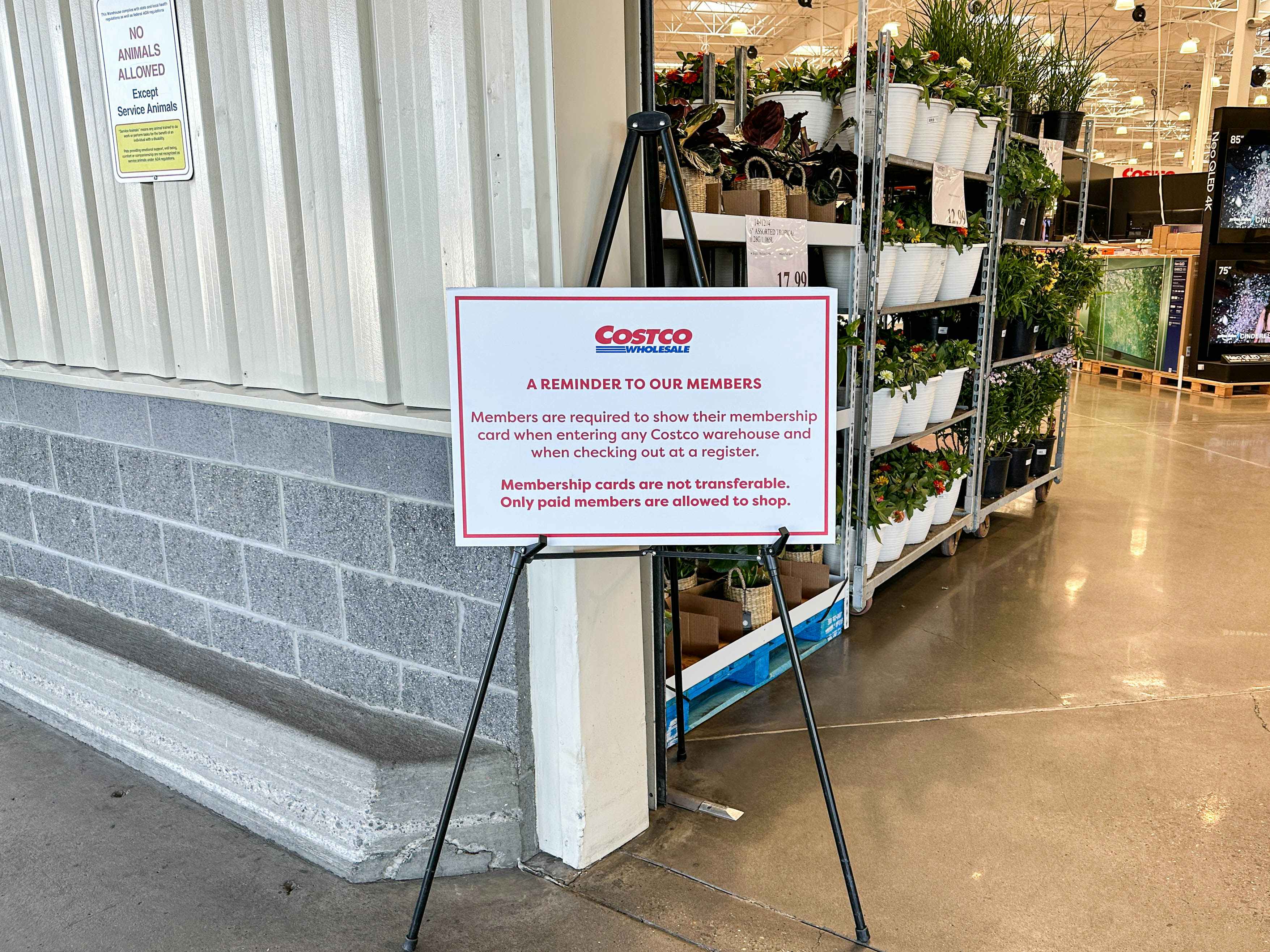 a costco membership rules signage on display in costco
