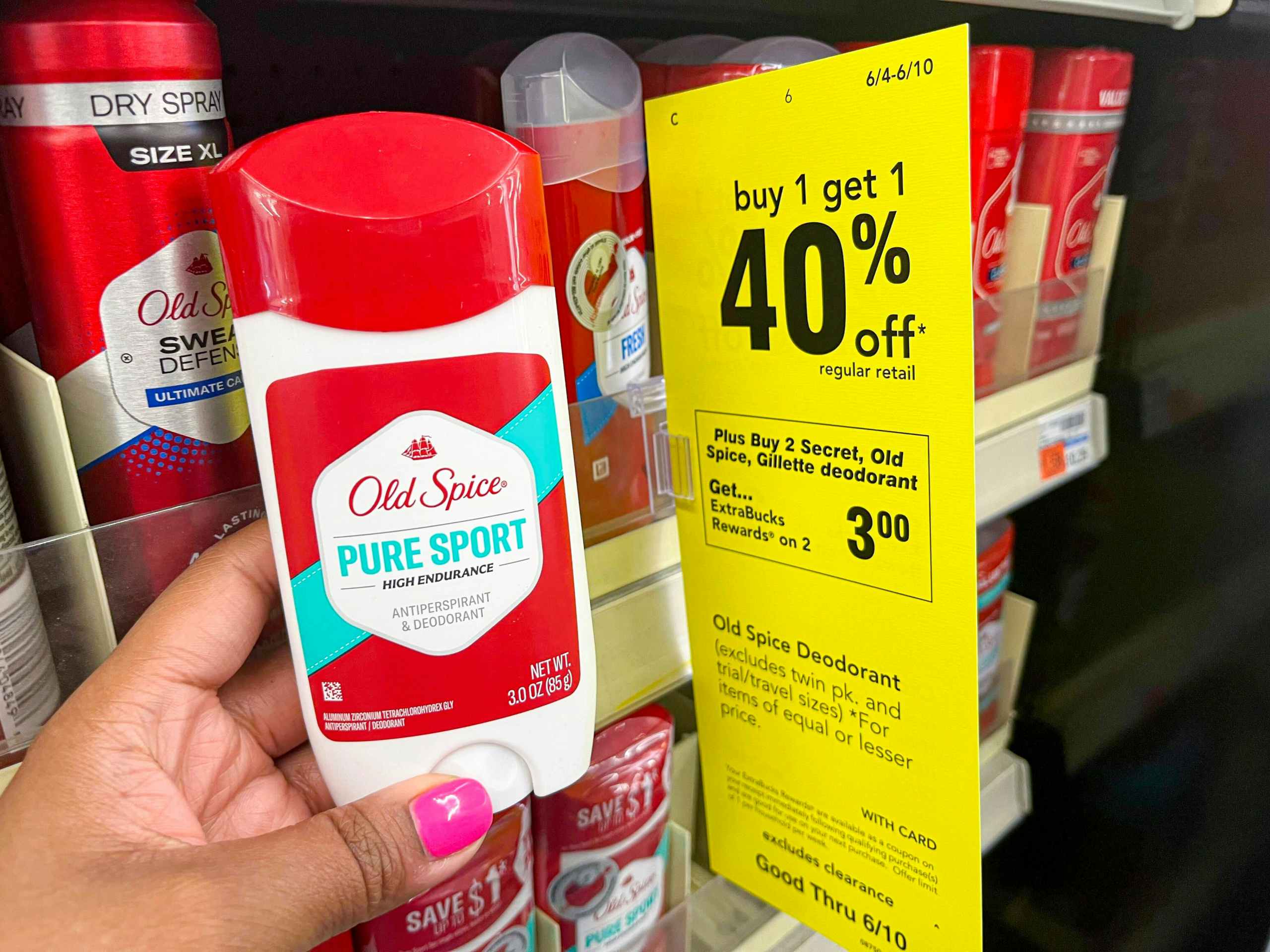 hand holding Old Spice Pure Sport deodorant next to sales tag