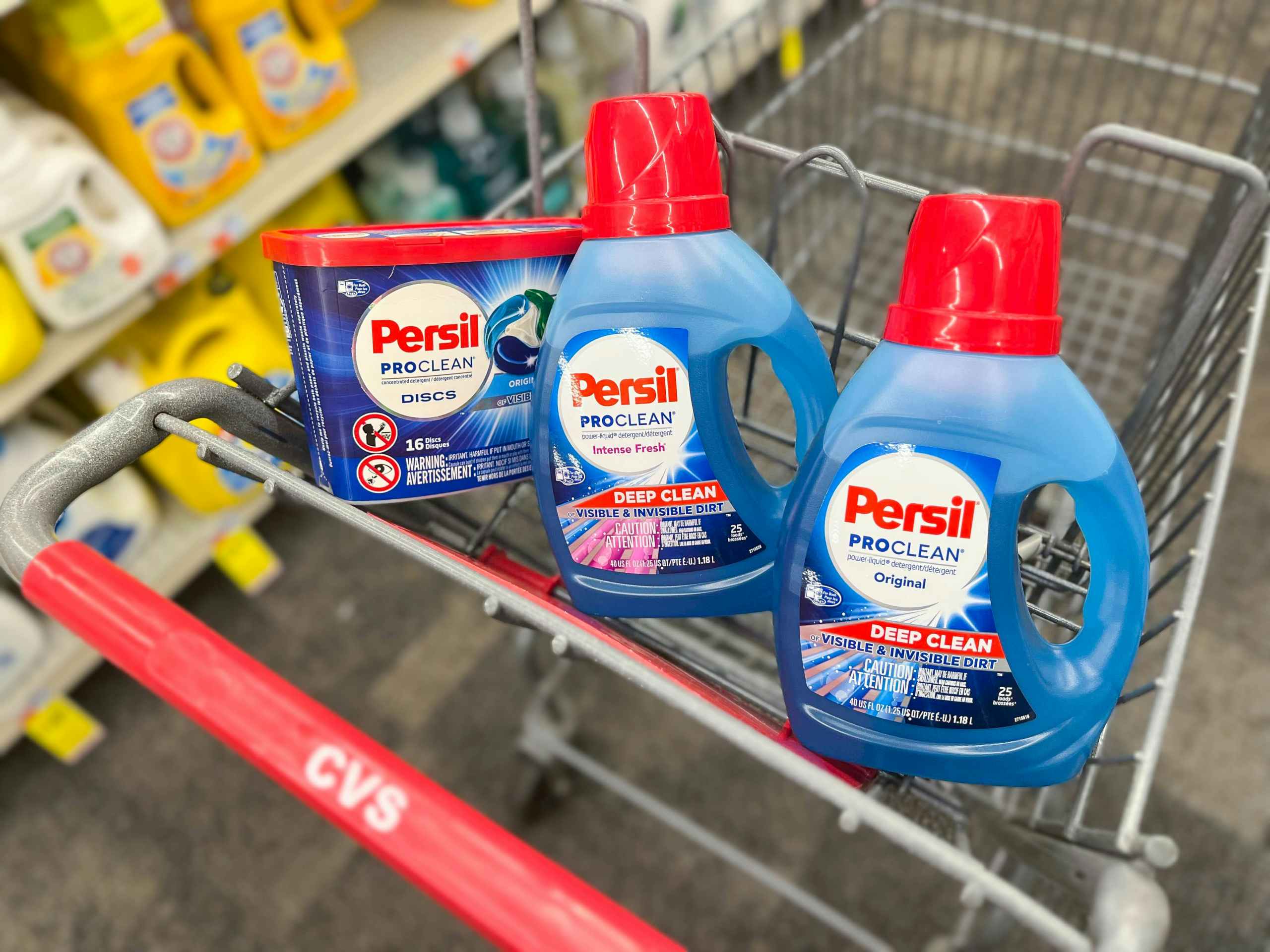 one Persil discs and two bottles of Persil detergent inside shopping cart