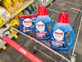 one Persil discs and two bottles of Persil detergent inside shopping cart