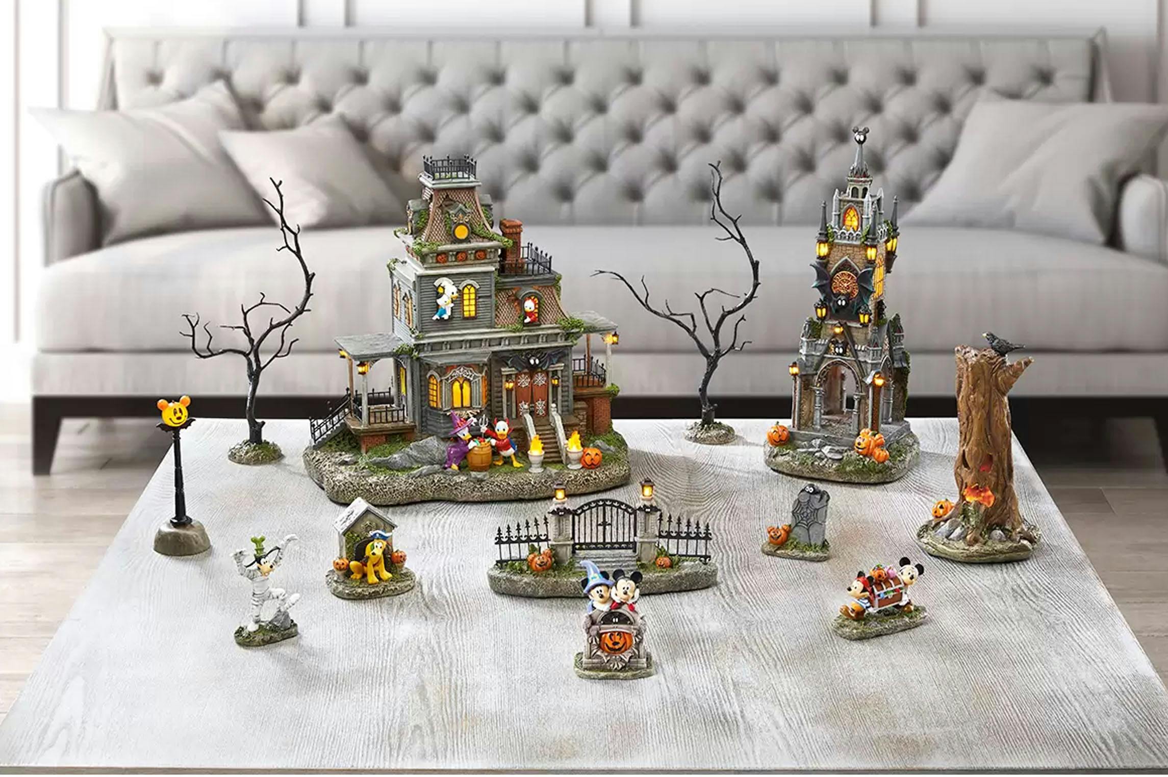 Disney Halloween pieces on a coffee table in front of a grey couch