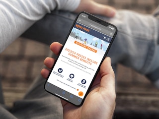 Someone looking on their phone at the Epic Pass website's page about military passes