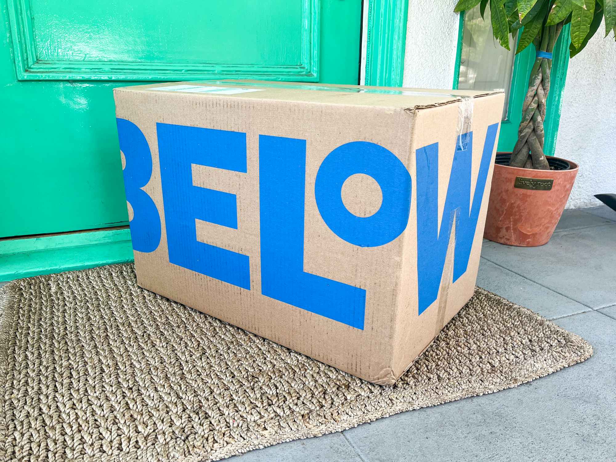 A Five Below box sitting on a front porch
