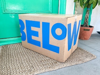 A Five Below box sitting on a front porch