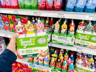 a hand holding up good2grow juice