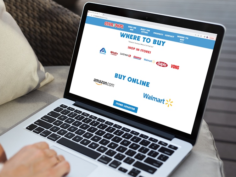 a person looking at the otter pop website on their macbook
