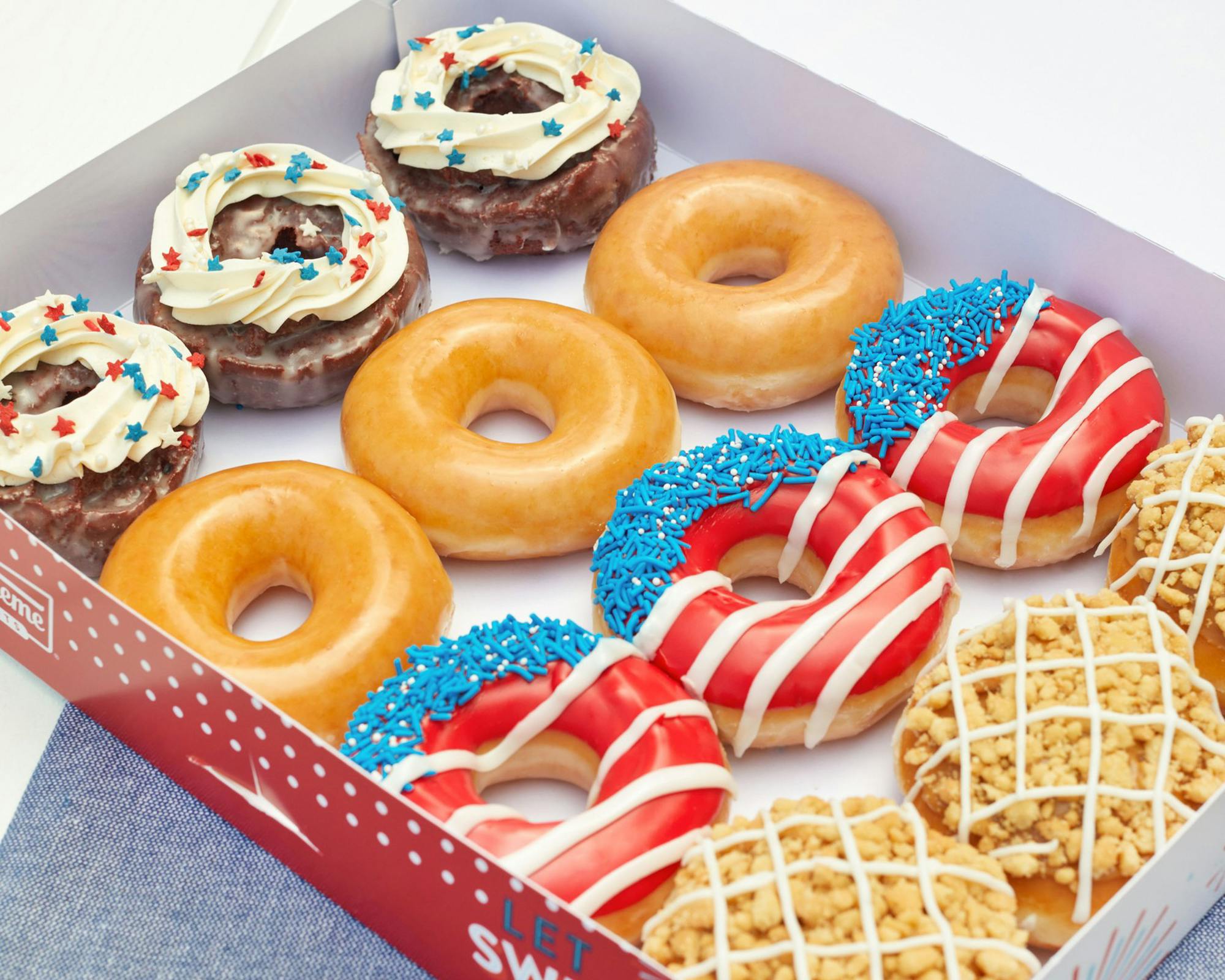 Red, White, and Blue themed doughnuts from Krispy Kreme in a box