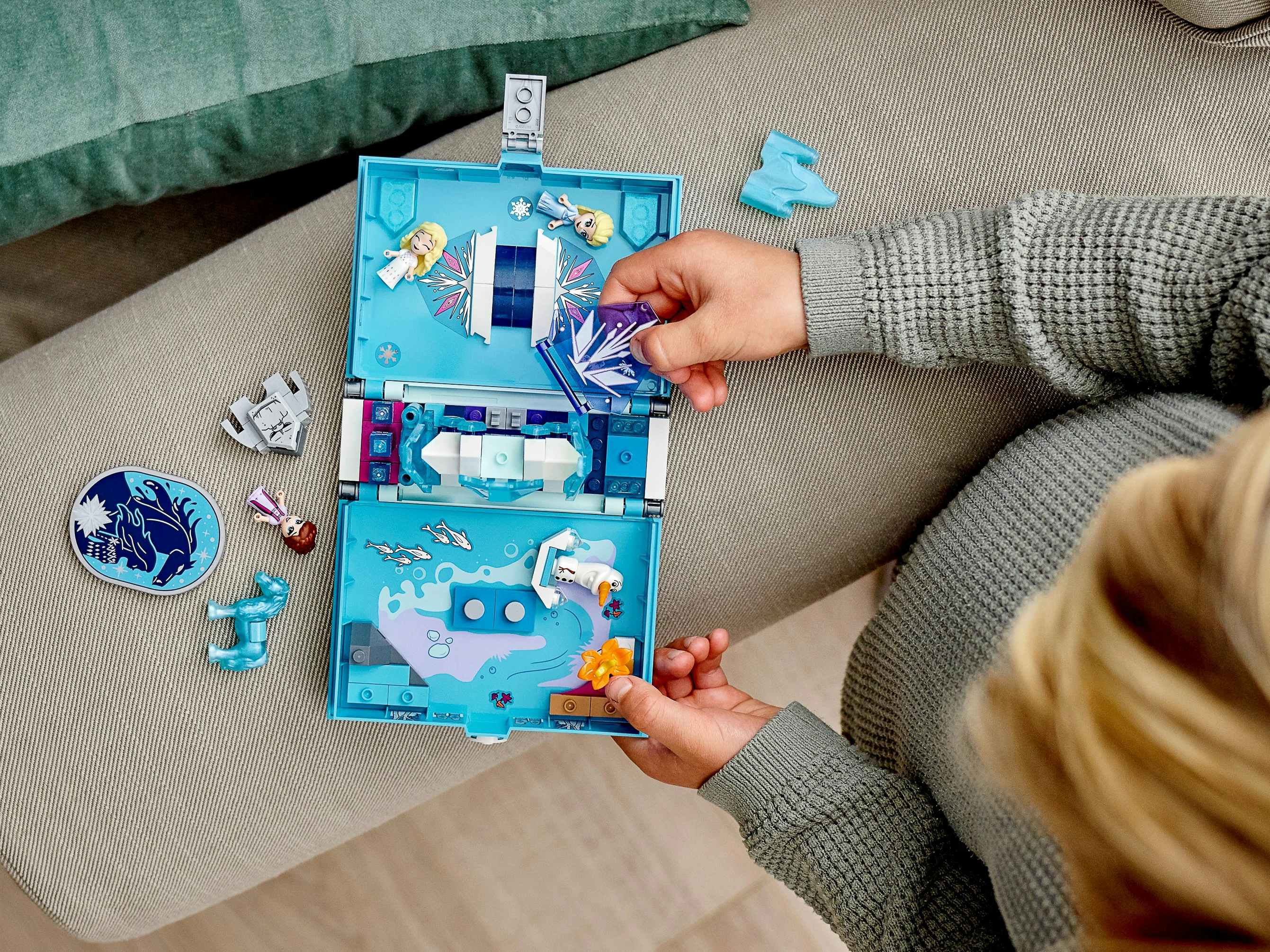 amazon lego sets - A kid playing with a storybook Lego set