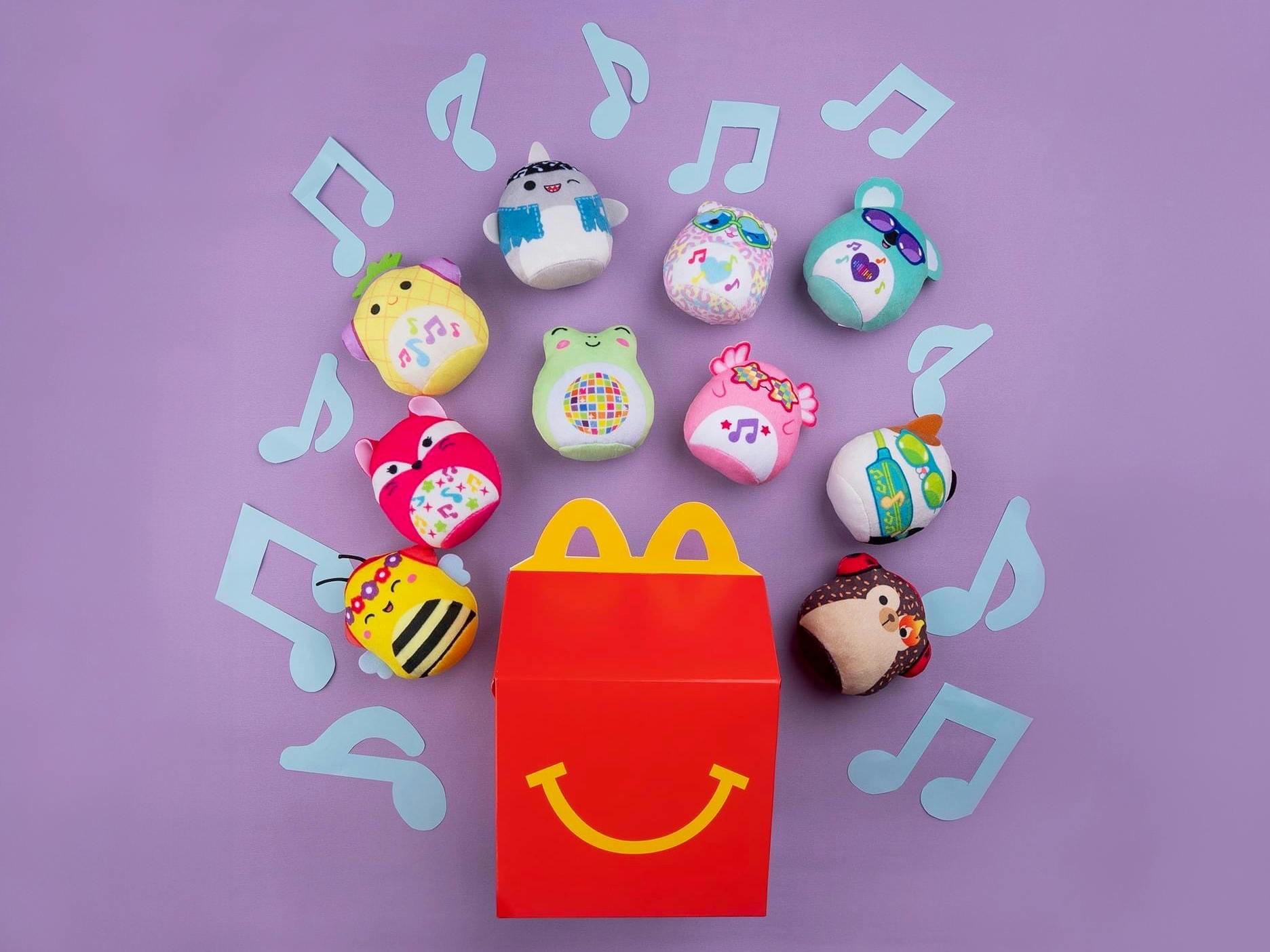 mcdonalds happy meal box with squishmallows toys and music notes