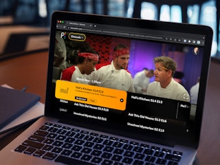 Someone streaming Hell's Kitchen on Peacock using a laptop