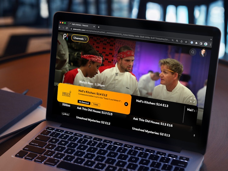 Someone streaming Hell's Kitchen on Peacock using a laptop