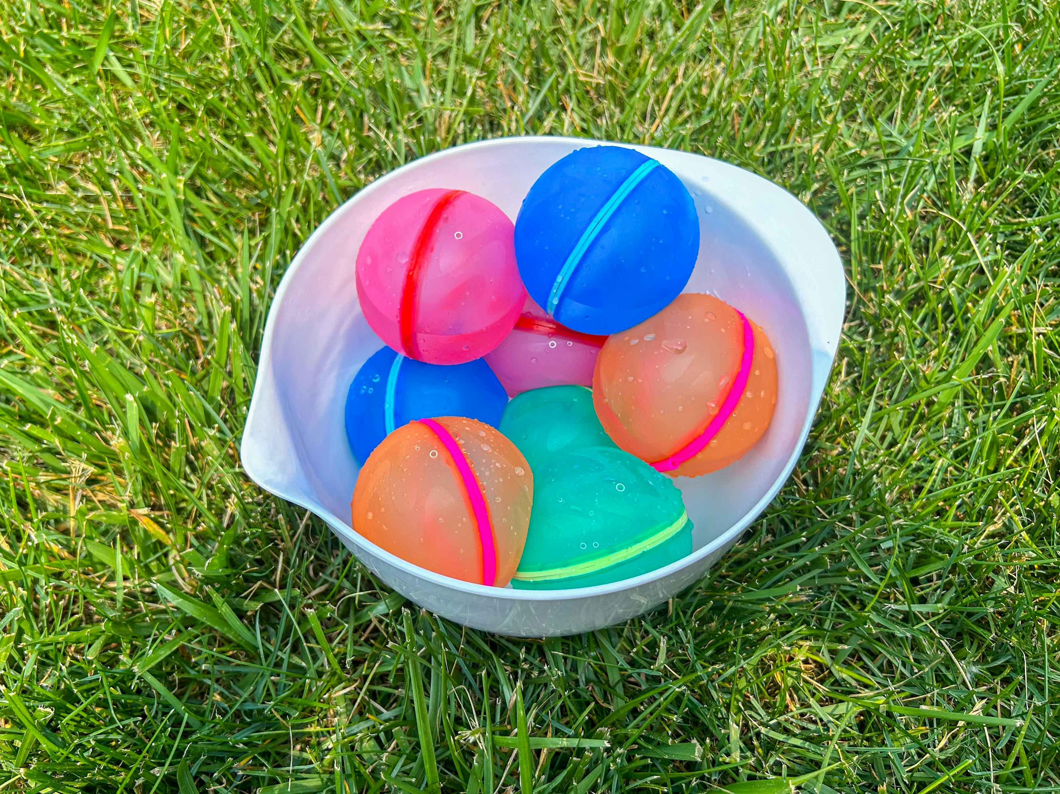 a bowl full of reusable water balloons 