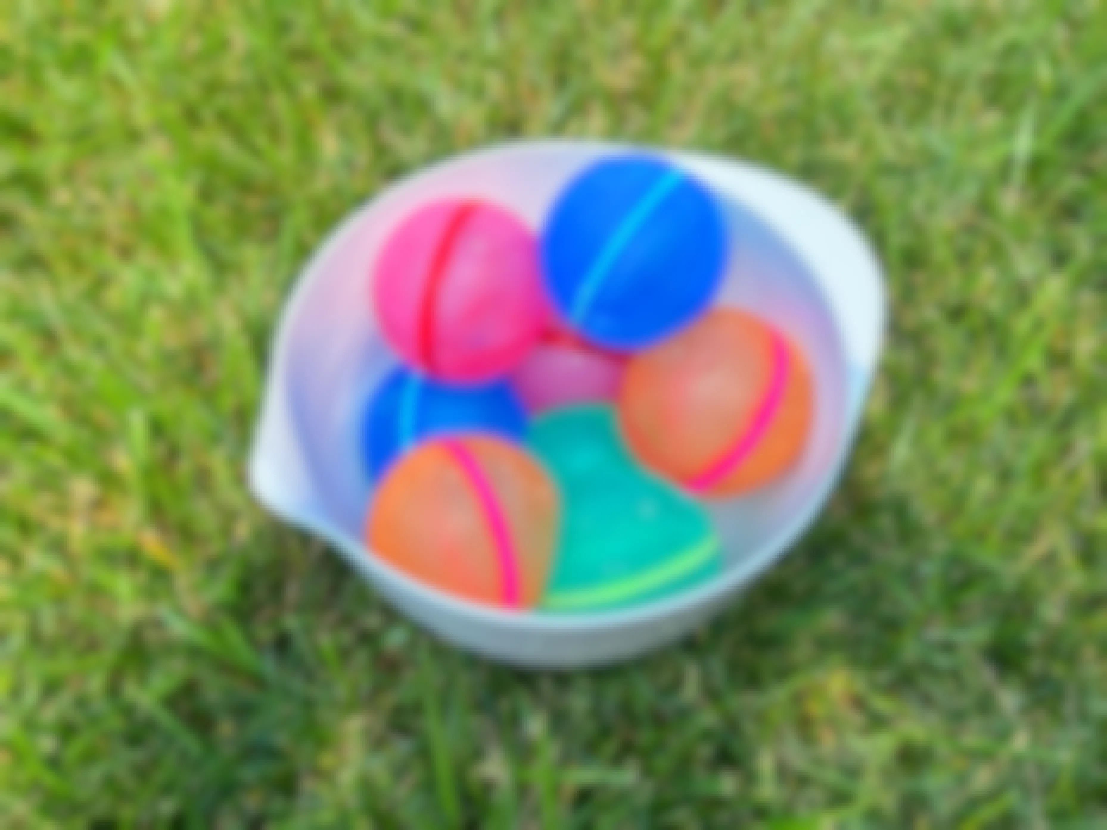 a bowl full of reusable water balloons
