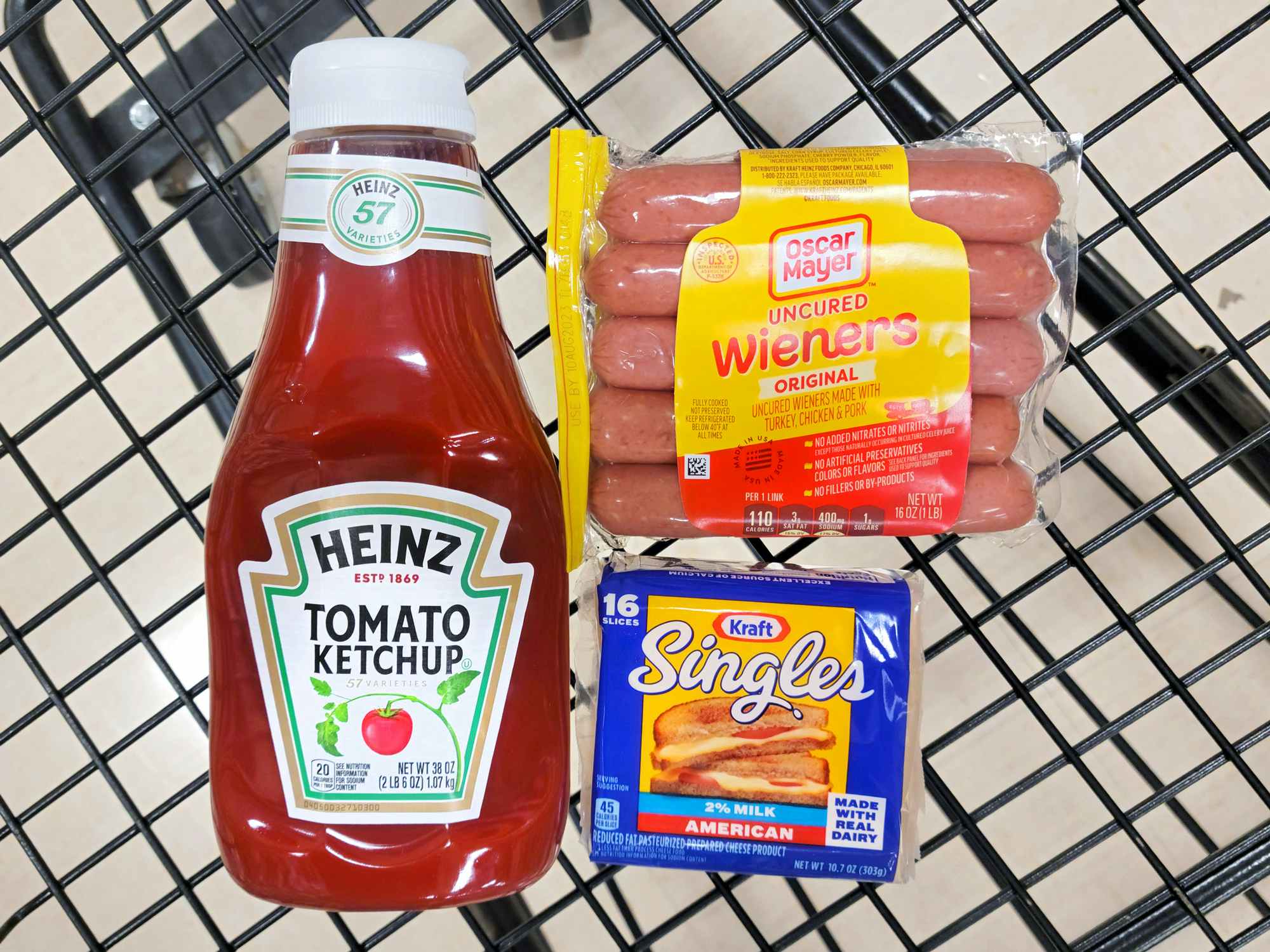 heinz tomato ketchup, oscar mayer weiners, and kraft singles in shopping cart