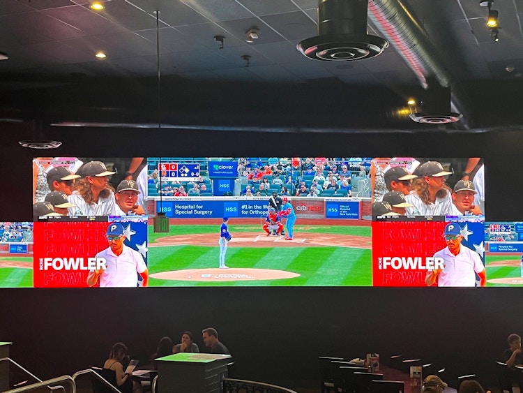 baseball game on big screens at dave and busters