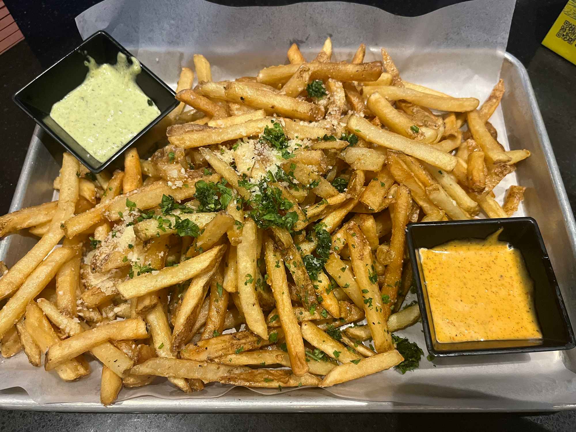 garlic parmesan truffle fries and dipping sauces at dave and busters