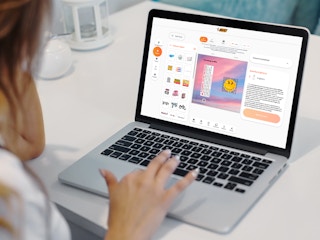 person on laptop designing a custom bic lighter online