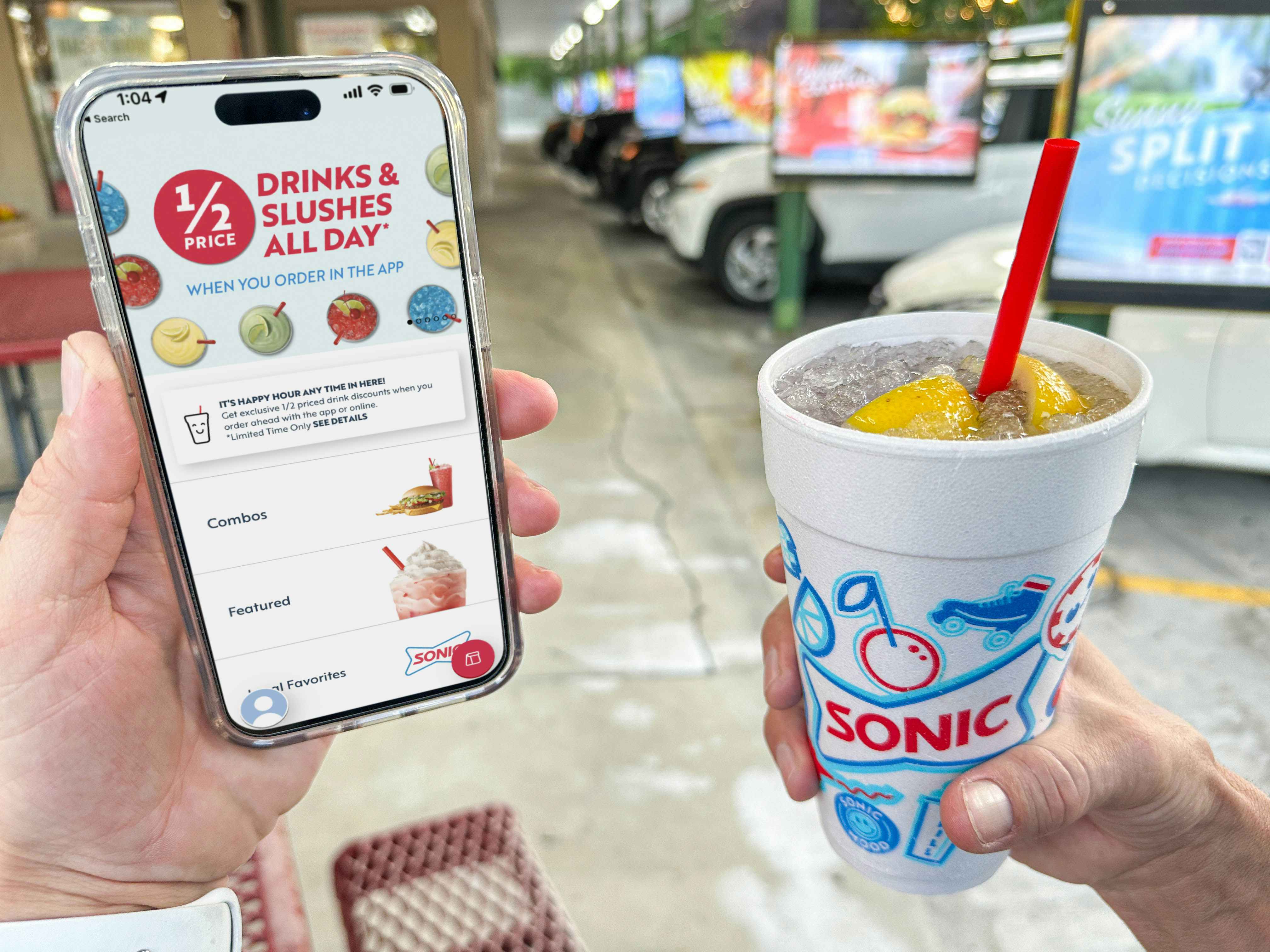 sonic app on cellphone while a person is holding a sonic drink