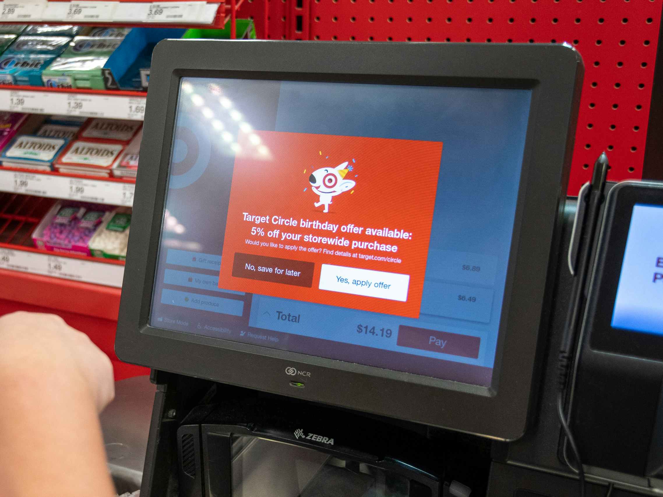 the self-checkout screen at target showing a birthday reward available for 5% off a purchase