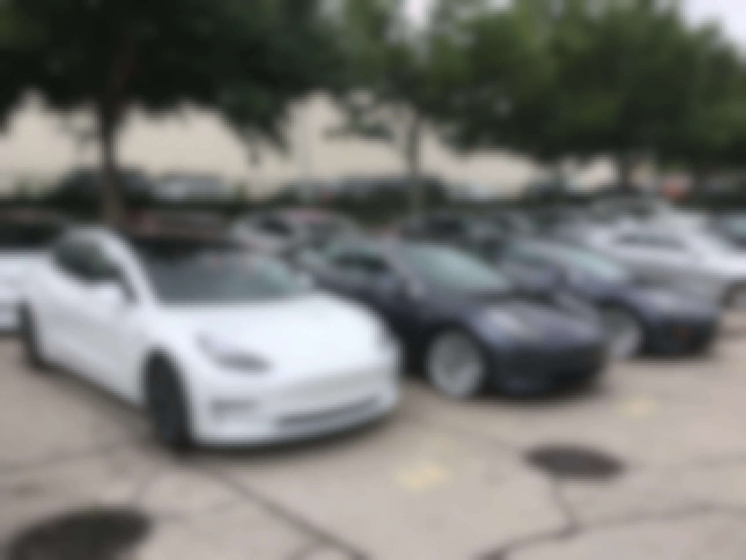 A parking lot full of Tesla model 3 electric vehicles