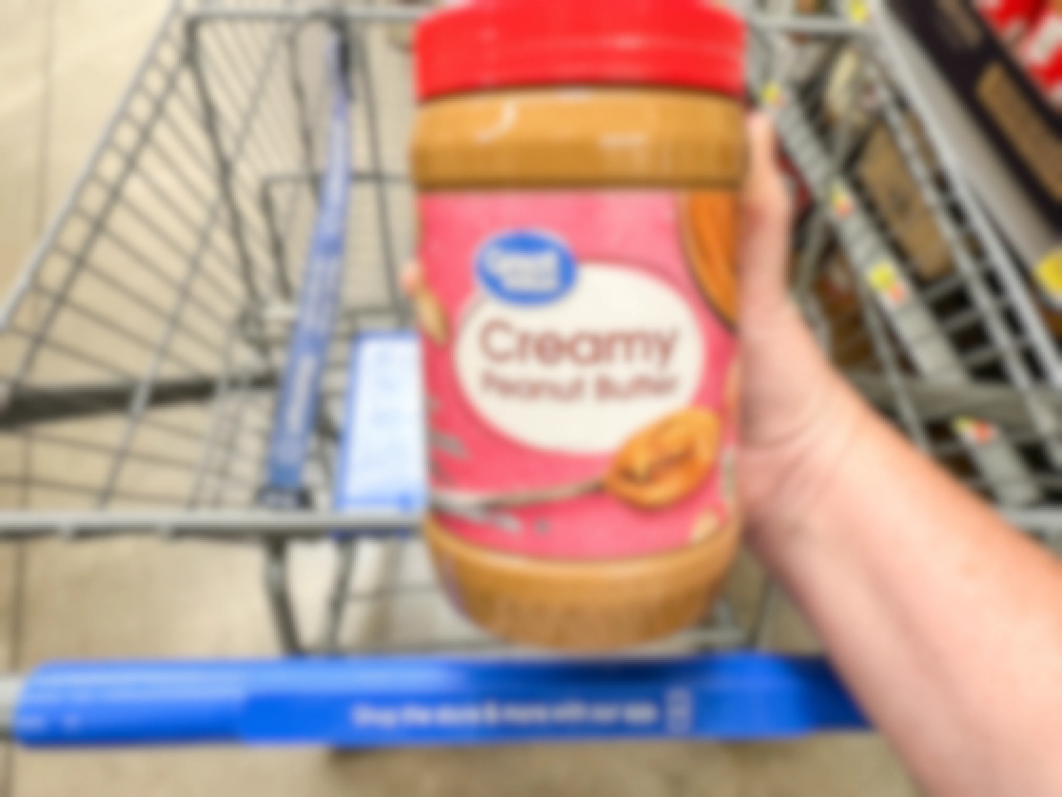 a jar of peanut butter being held in store 