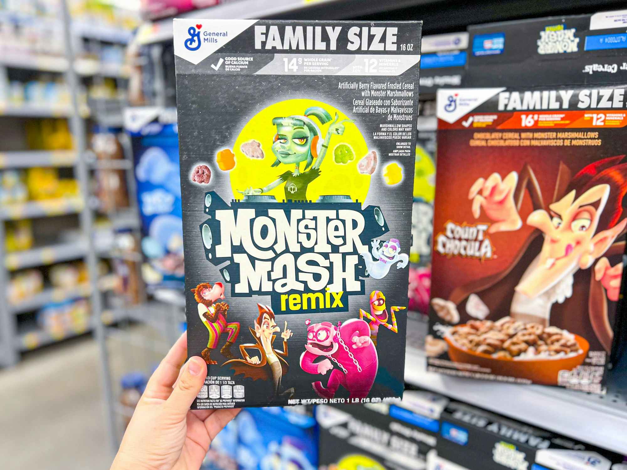 someone holding up a box ofMonster Mash Remix monster cereal at Walmart