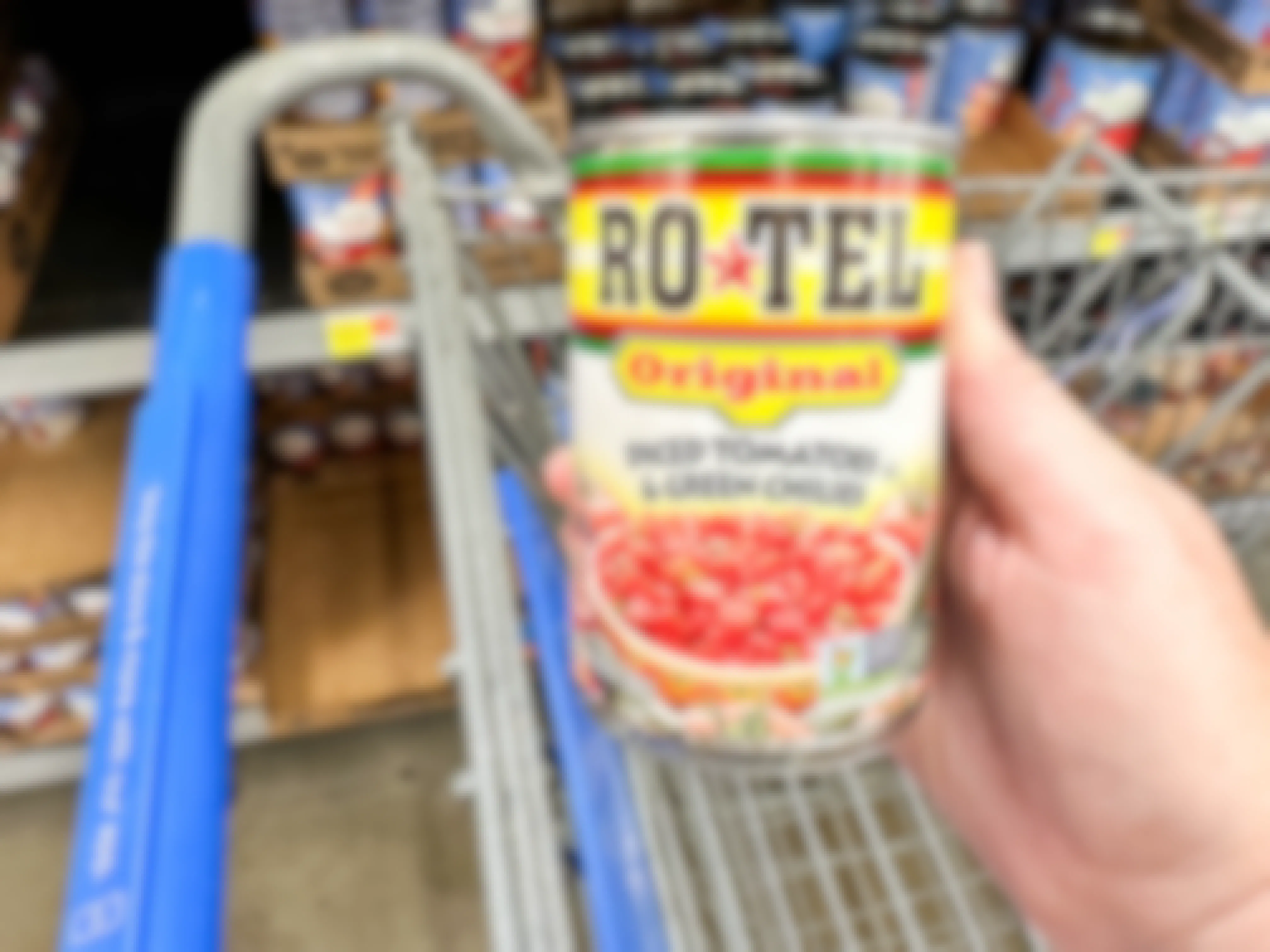 a can of rotel tomatoes being held in store 
