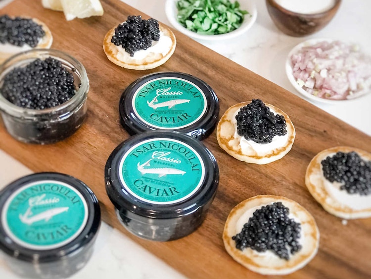 Tsar caviar sitting on a table 
