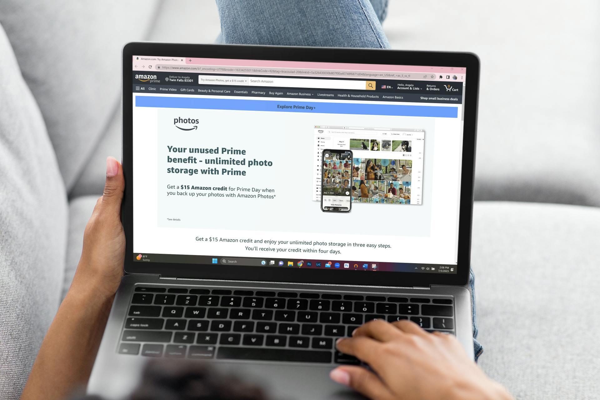 a prson on a laptop looking at amazon photos