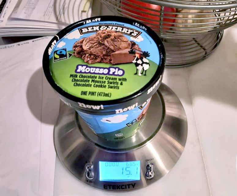ben and jerrys pint of mousse pie ice cream on a scale showing a weight of 15.1 ounces