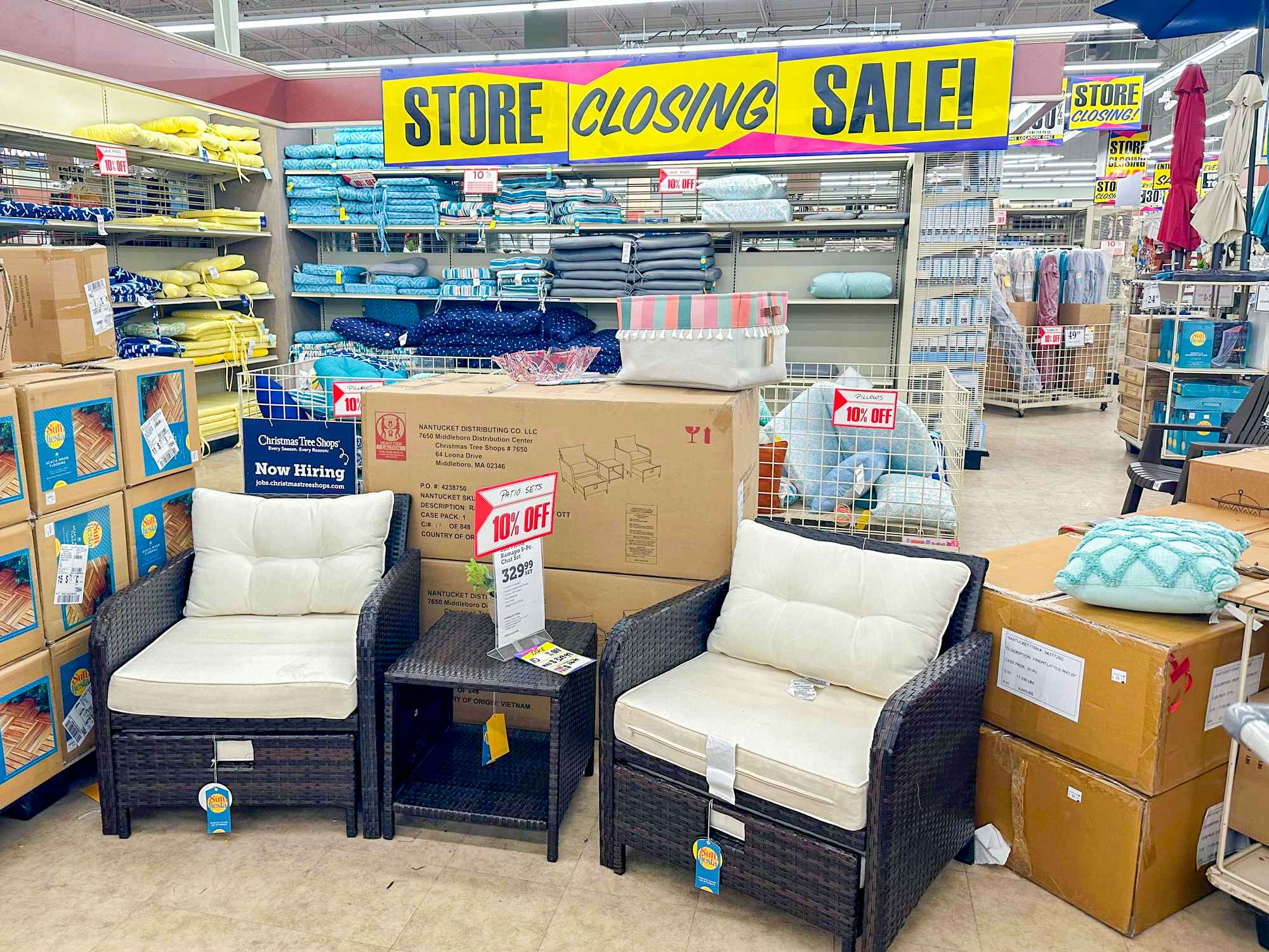 christmas tree shops with patio furniture and store closing sale signage
