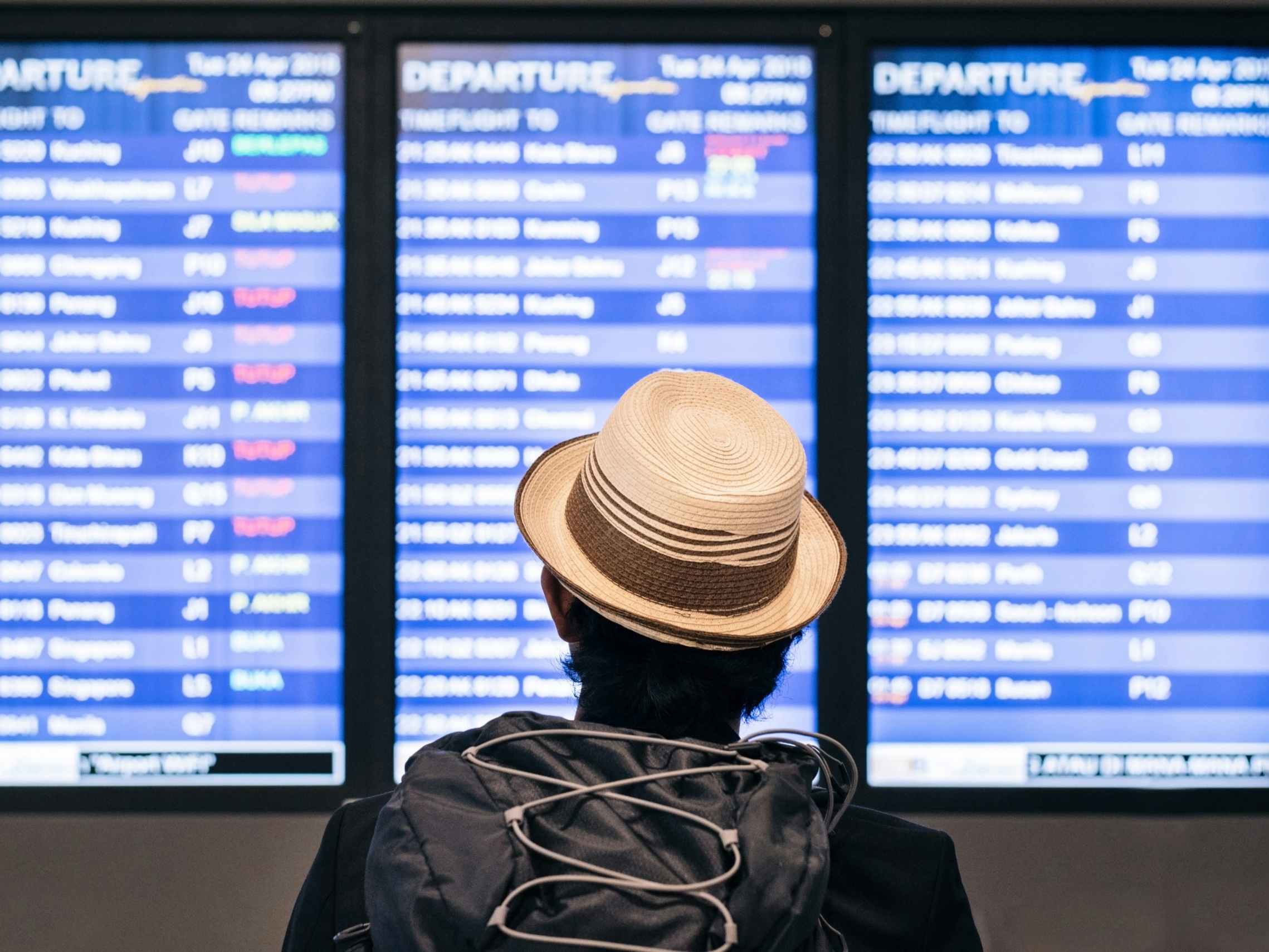 Person looking at a flight time table
