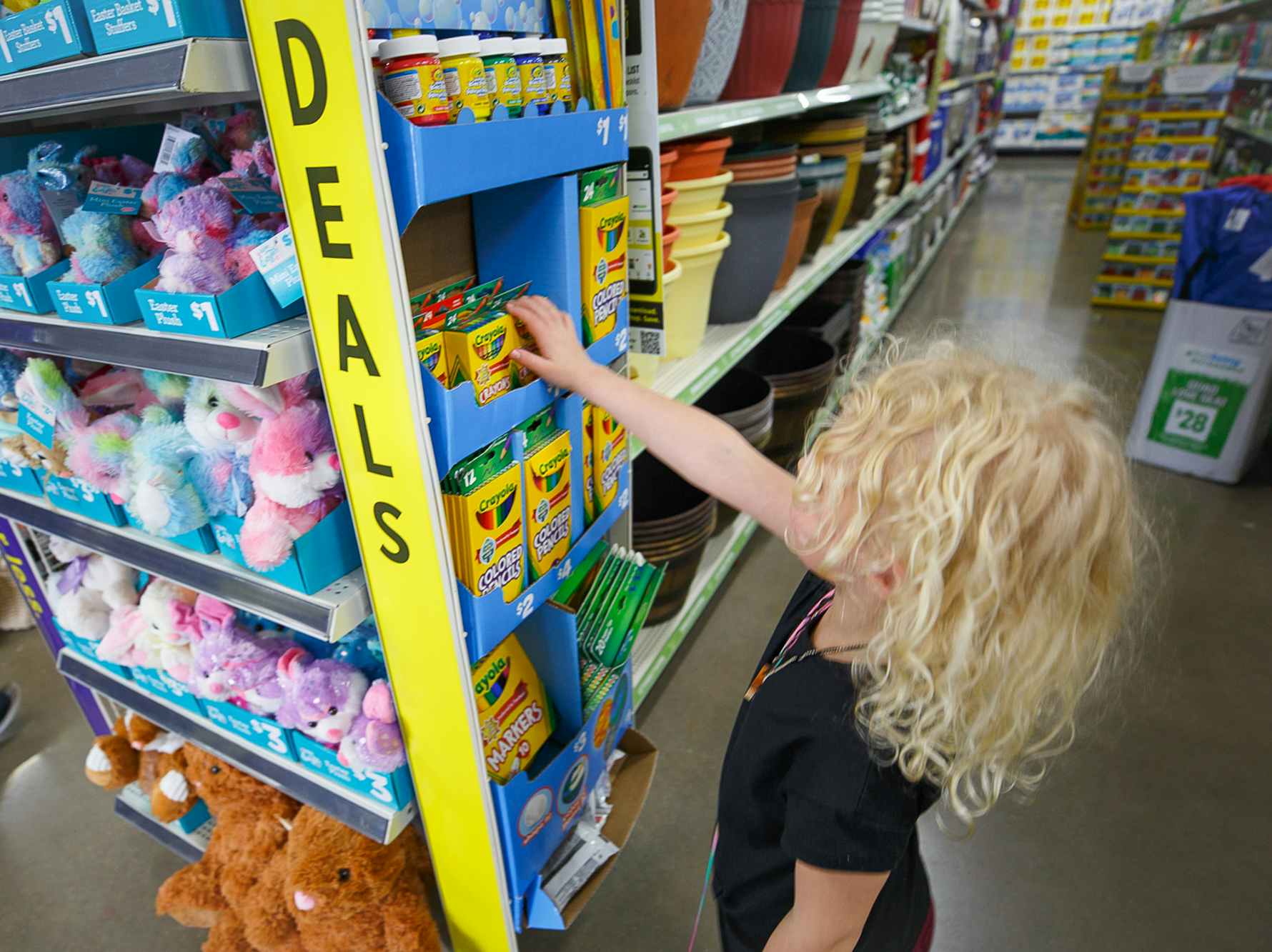 A child picking out school supplies at Dollar General