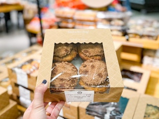 someone holding a box of coffee cakes in the Target bakery
