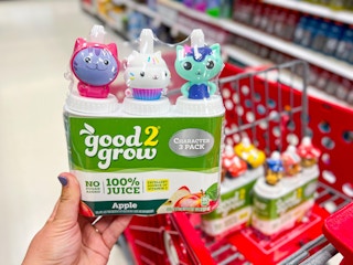 Hand holding a good 2 grow bottle pack