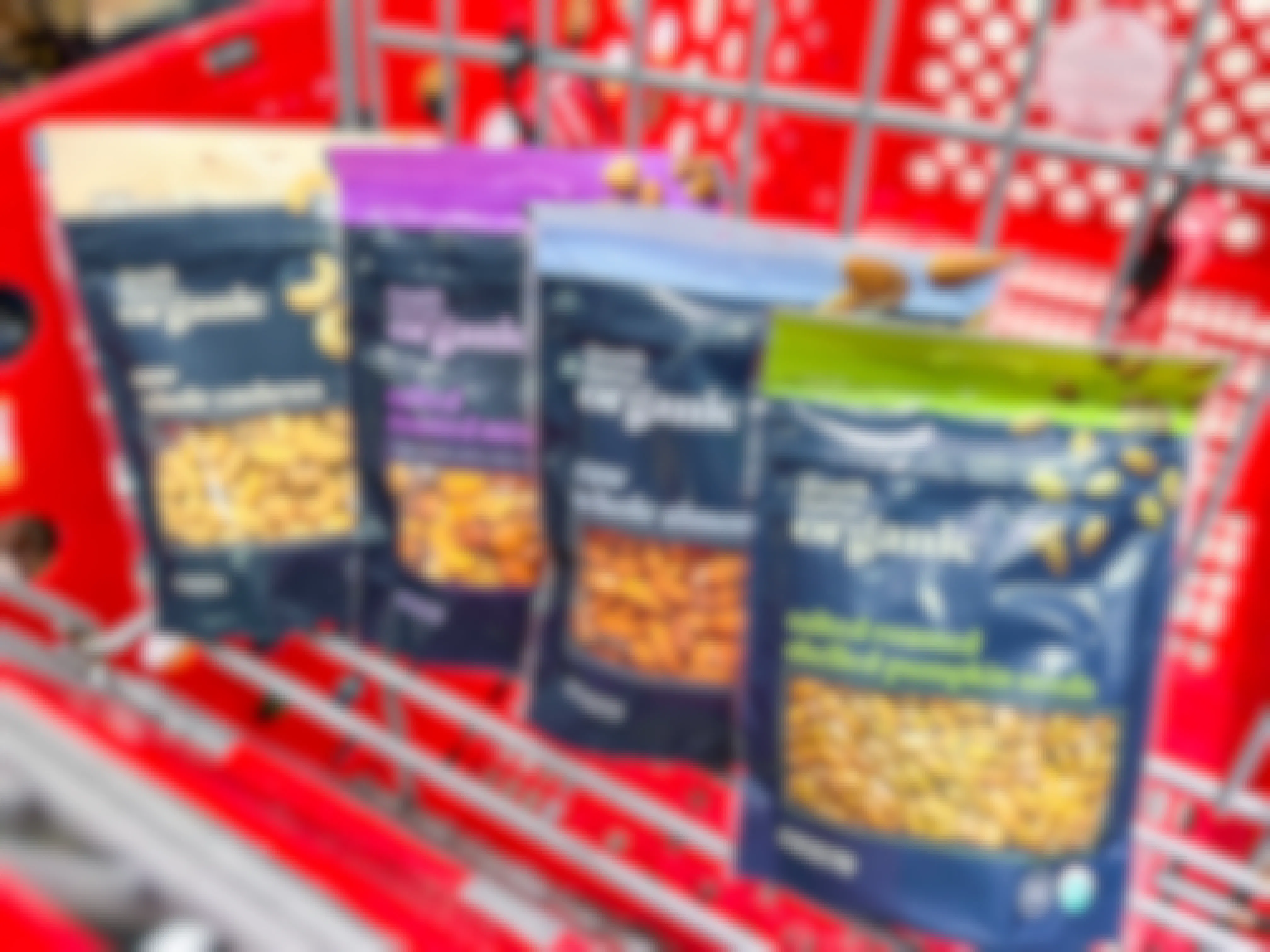 four bags of various nuts from Good & Gather in a target shopping cart
