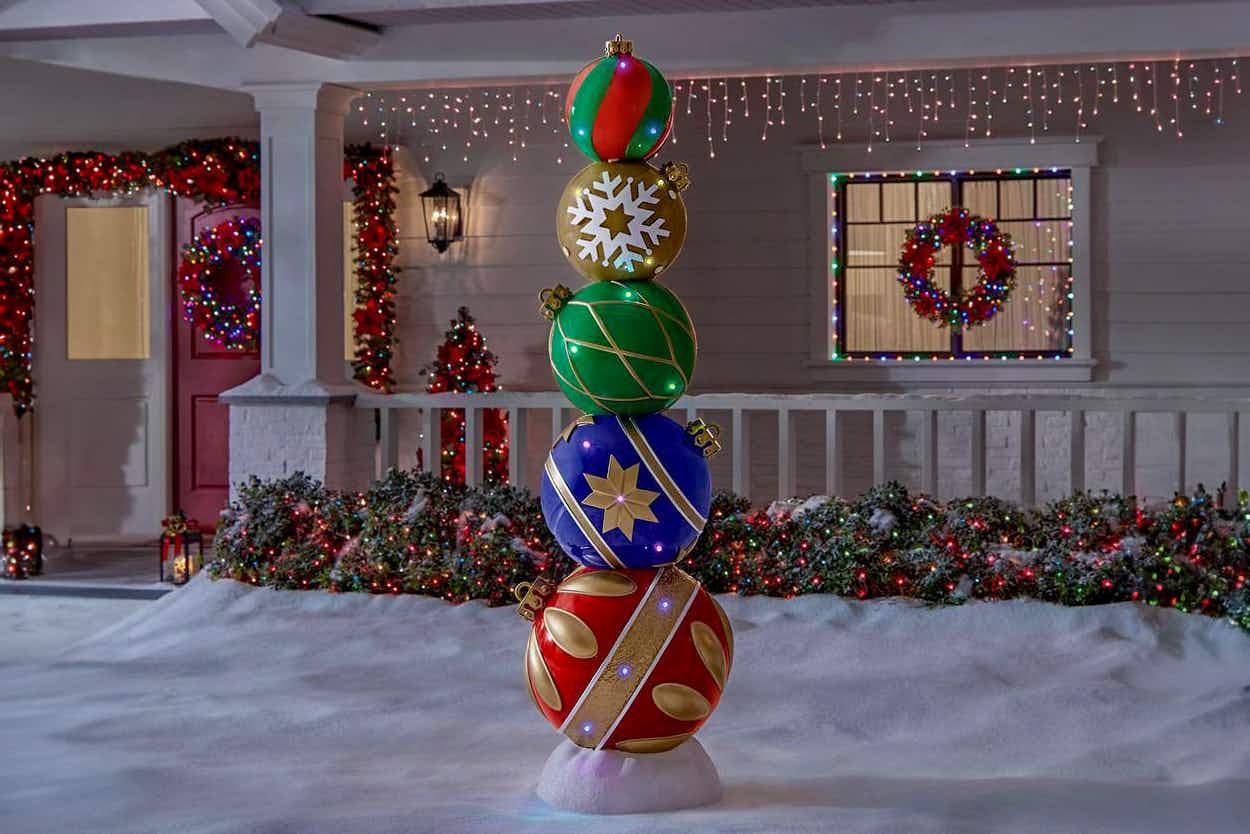 a yard decoration that is a large stack of ornaments