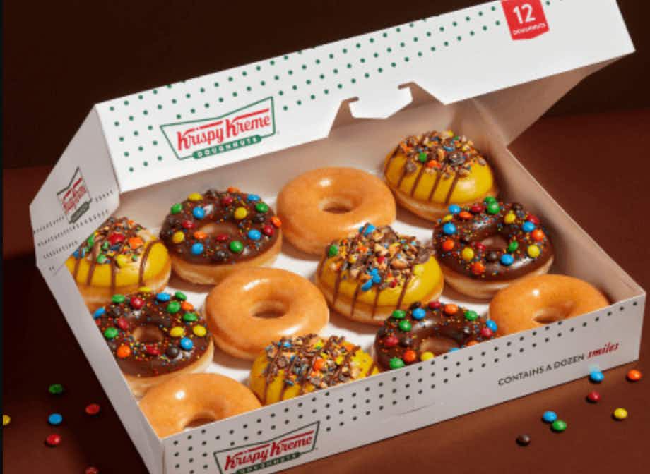 krispy kreme assorted M&M doughnuts against a brown background