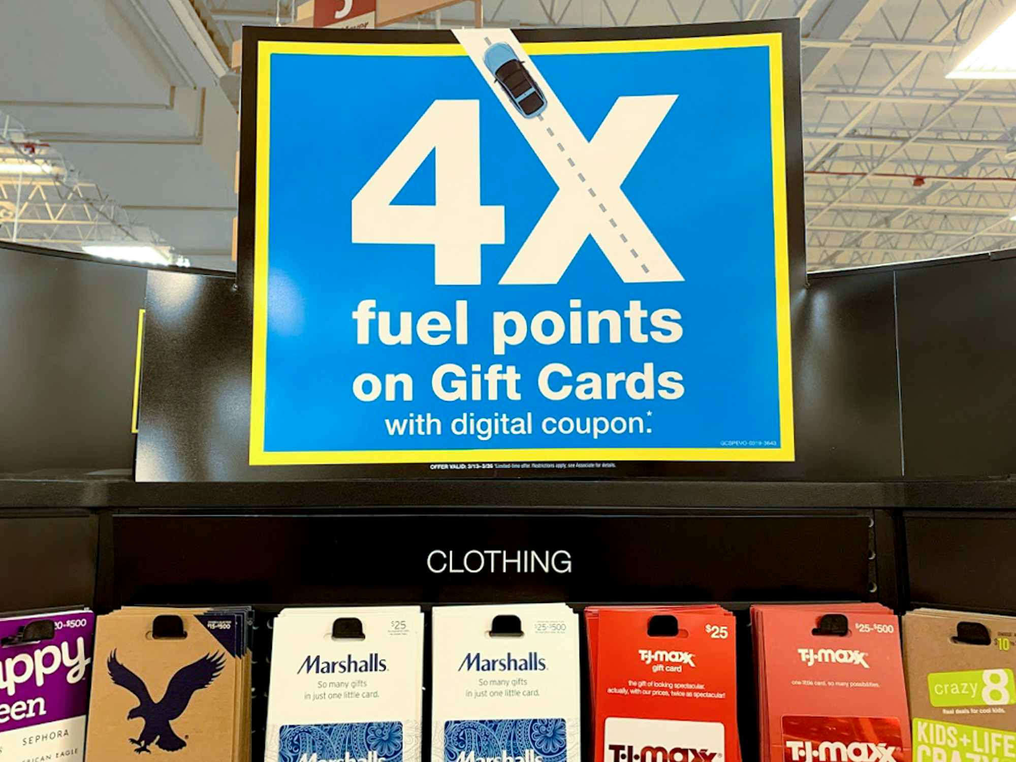 A sign for 4x fuel points on gift card purchases at Kroger