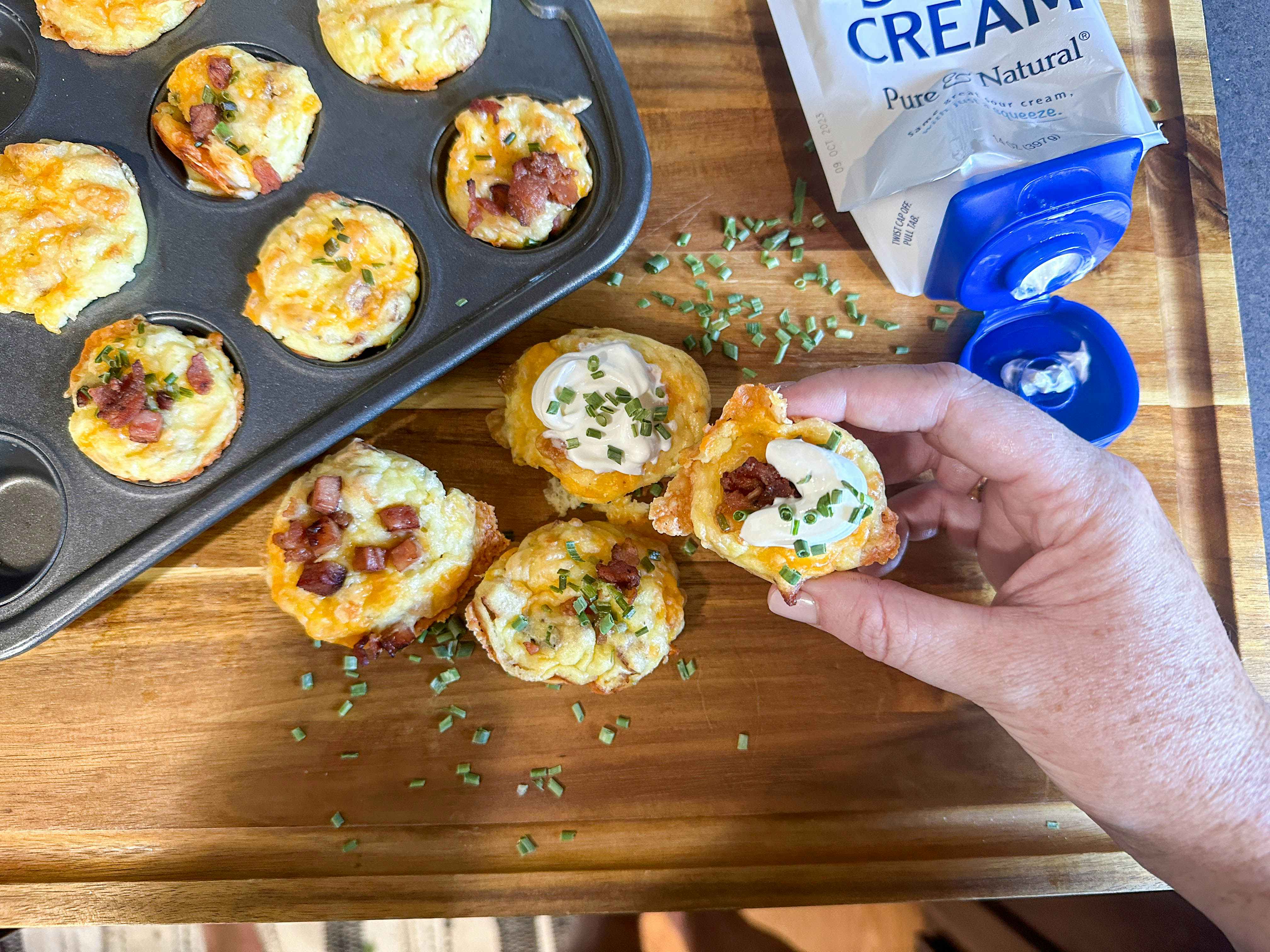 Mashed potato puffs on a counter and in a muffin pan 
