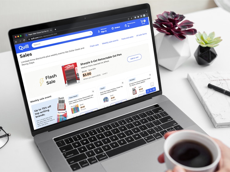 The page of sales on the Quill.com website displayed on a laptop