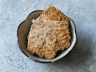bowl of crackers made from dehydraded pulp and almond milk