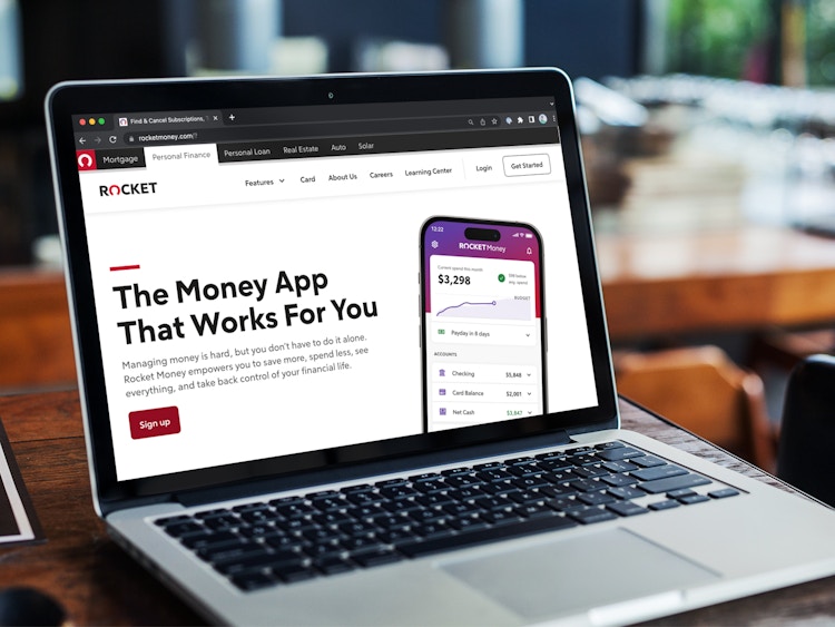 A laptop displaying the Rocket Money home page