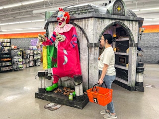 a person looking at spirit halloween animatronics